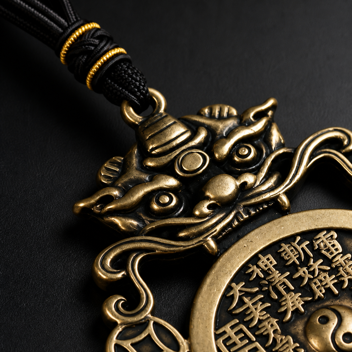 Close-up of the antique brass guardian motif and engraved coin details