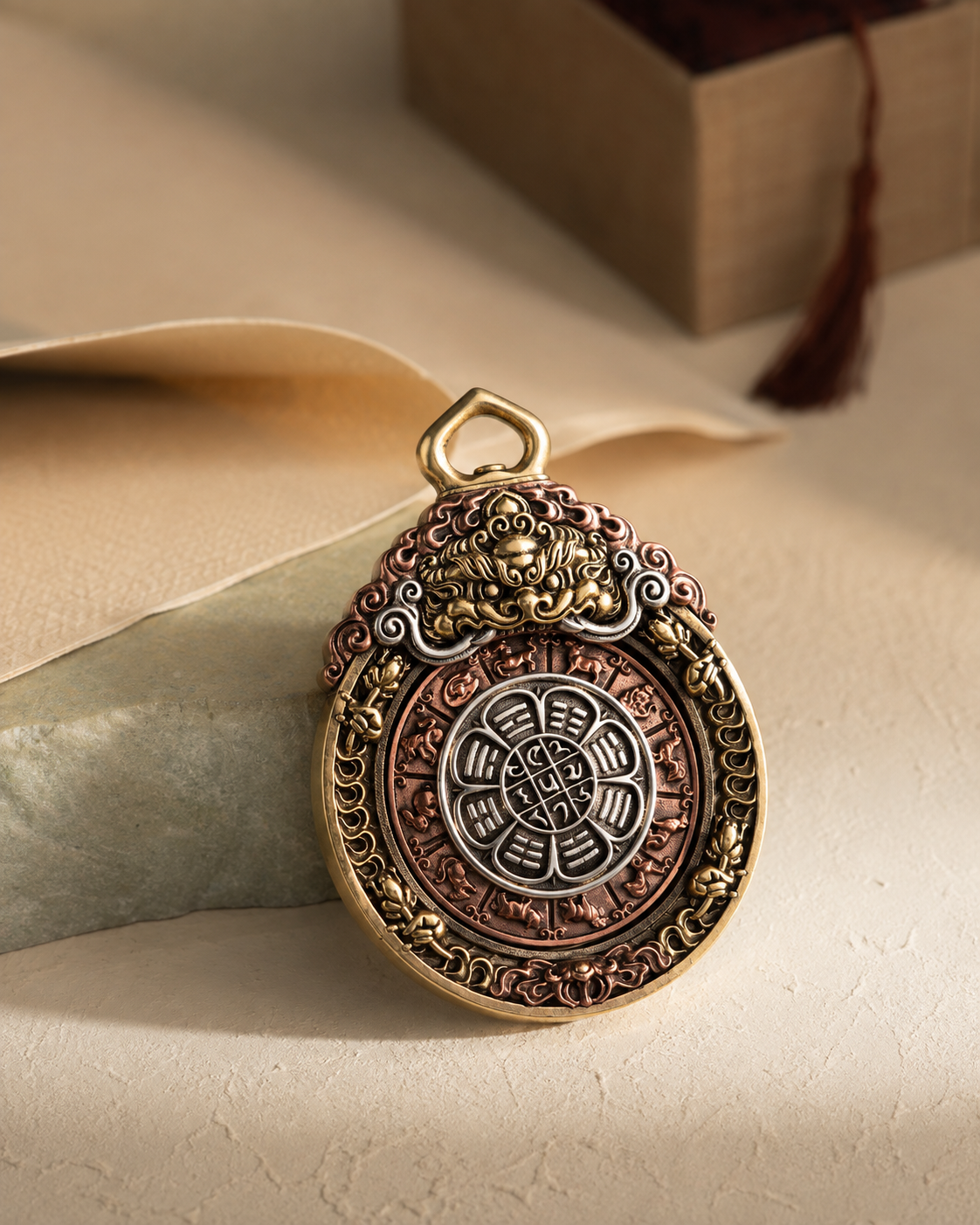 JIU GONG double-sided rotating pendant in warm antiqued metal tones